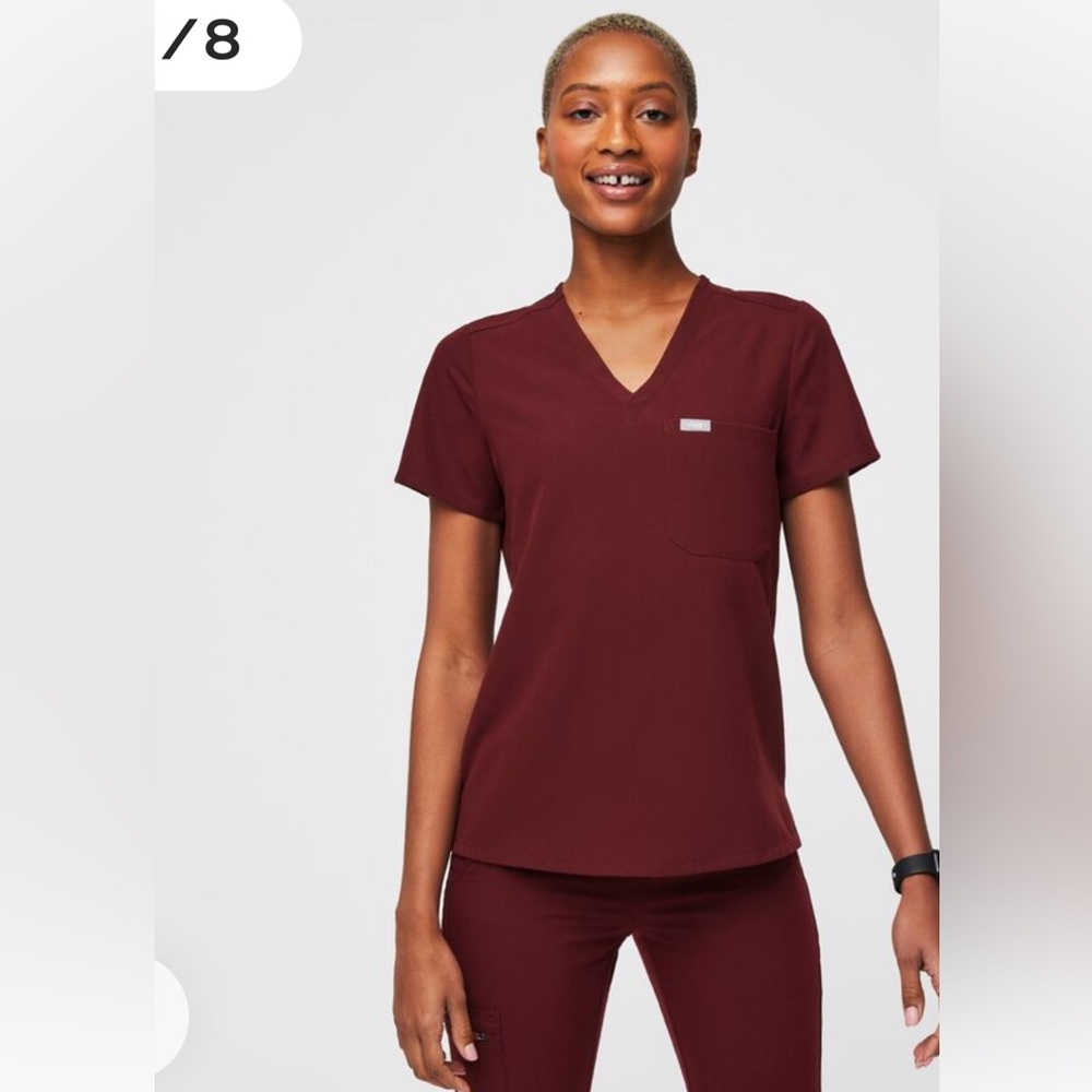 FIGS Technical Collection Catarina One Pocket Scrub Top in Burgundy.
